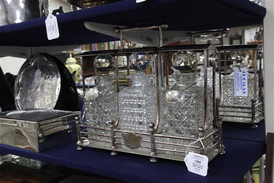 An early 20th century silver plated tantalus by Hobbs & Co, London, with three hobnail cut glass decanters & pr of wine labels, 1.75in.